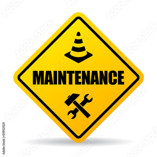 Yellow caution maintenance sign photo