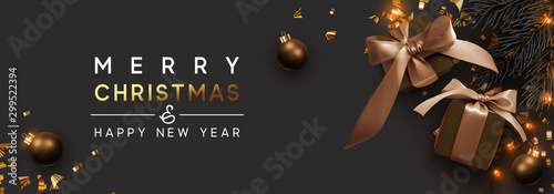 Merry Christmas and Happy New Year. Background with realistic festive gifts box. Xmas present. brown boxes with beige ribbon gift surprise, Golden Christmas baubles, balls, glitter gold confetti.