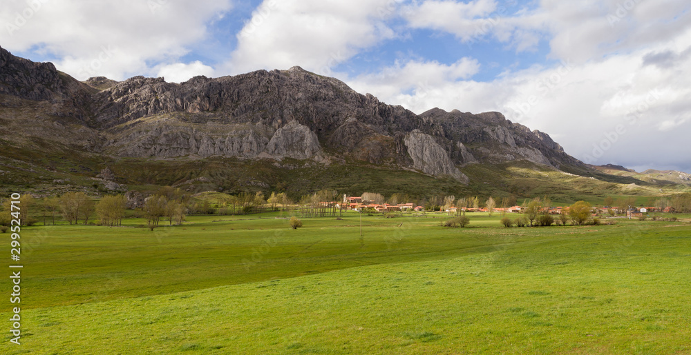 Nice Mountain Village (Cubillas de Arbas) in valley with green spring meadows, Leon province, Spain 