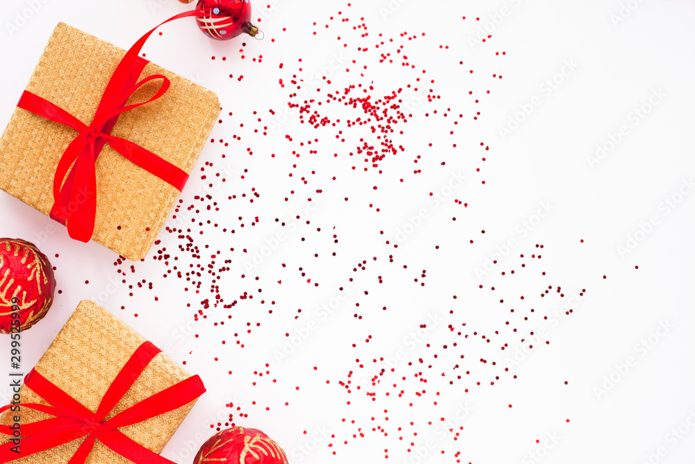 Christmas composition. Beautiful toys, gifts and candy on the white background. New year background. Top view. Close up. Space for a text. - obrazy, fototapety, plakaty 