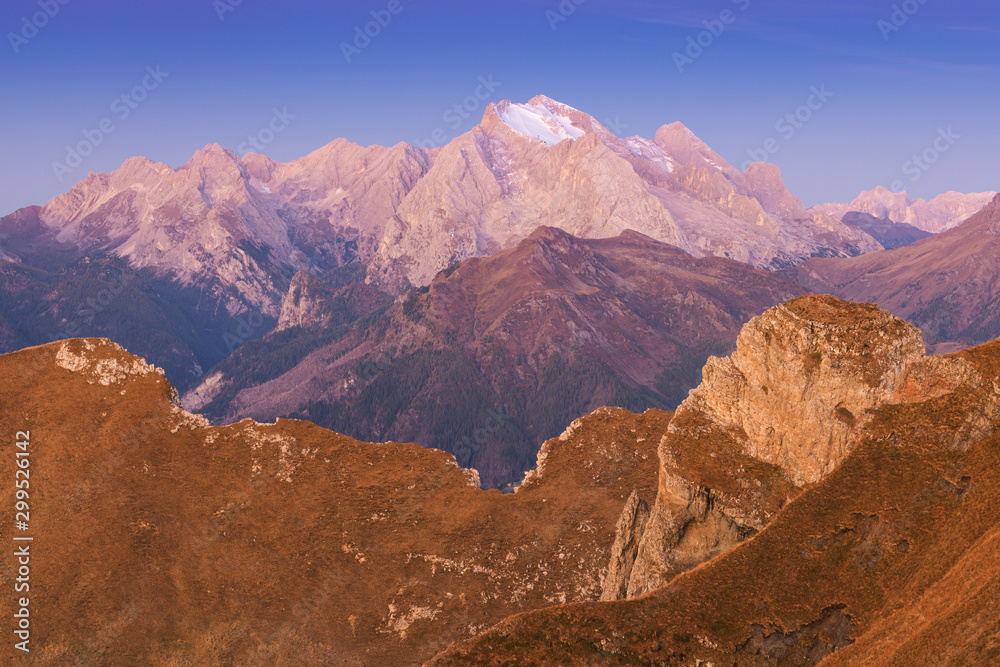Autumn view of the Passo Giau valley in the Italian Dolomites and the snow-capped Marmolada glacier. Marmolada is the highest mountain, Dolomiti, northern Italy. Dolomites on a beautiful autumnal day.