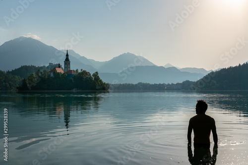 Silhouette of an european man bathing in Lake Bled, Slovenia