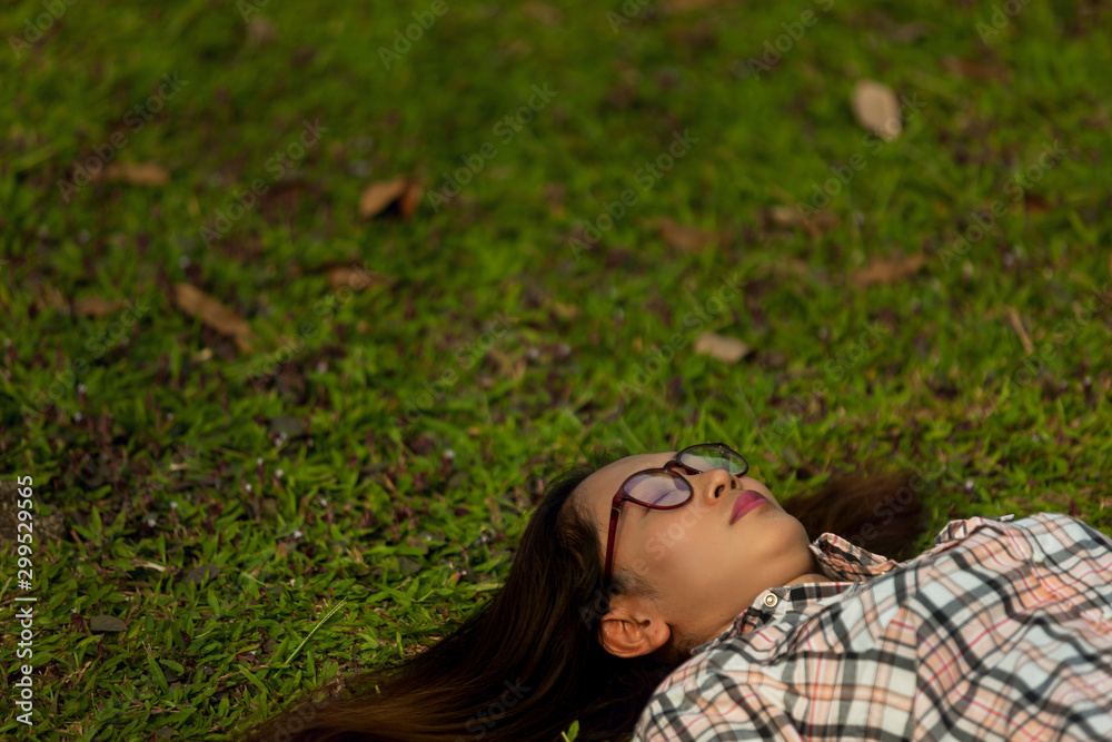 women are sleeping by the lawn