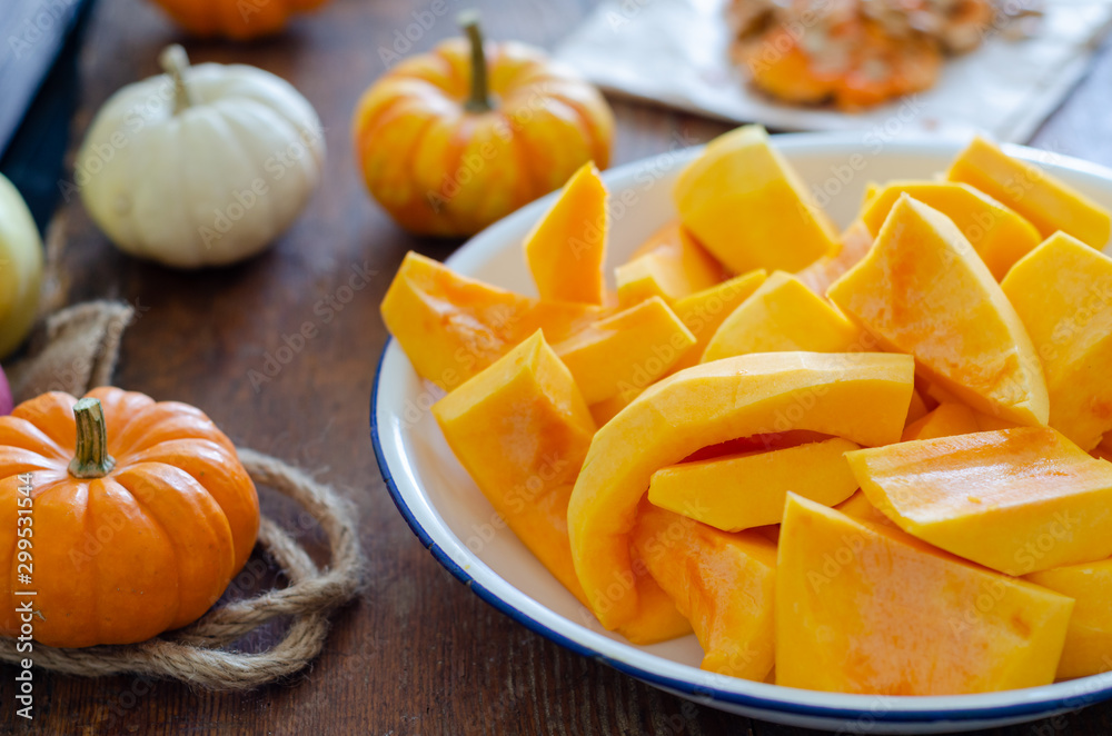 Sliced of the pumpkins in white enamel plate Sliced of the pumpkins in white enamel plate