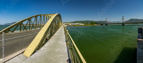 Old vintage Treto iron bridge over the Limpias river