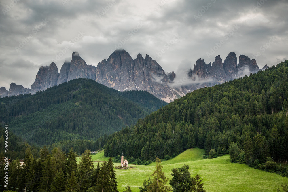 Dolomites, Italy - July, 2019: Famous best alpine place of the world, Santa Maddalena village with Dolomites mountains in background, Val di Funes valley, Trentino Alto Adige region, Italy, Europe