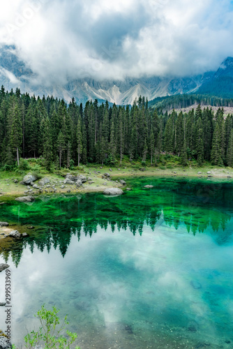 Vertical view of Lake Carezza with reflections
