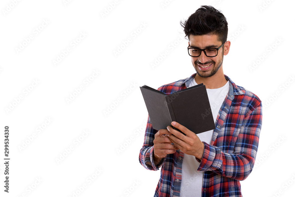 Portrait of young bearded Persian hipster man reading book Portrait of young bearded Persian hipster man reading book