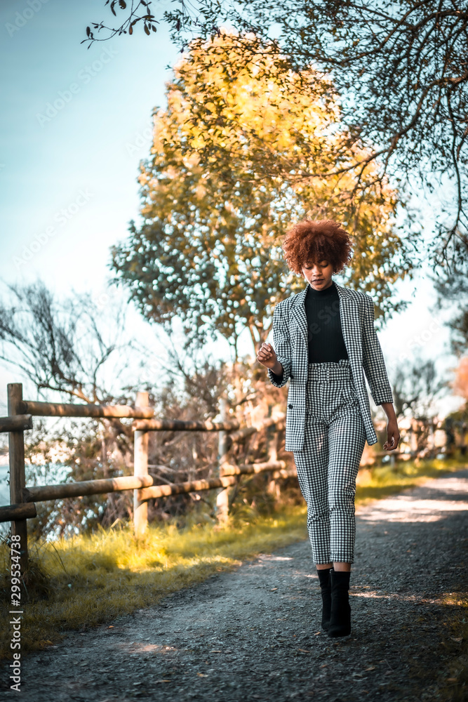 Lifestyle session, A young Dominican woman walking in autumn Lifestyle session, A young Dominican woman walking in autumn