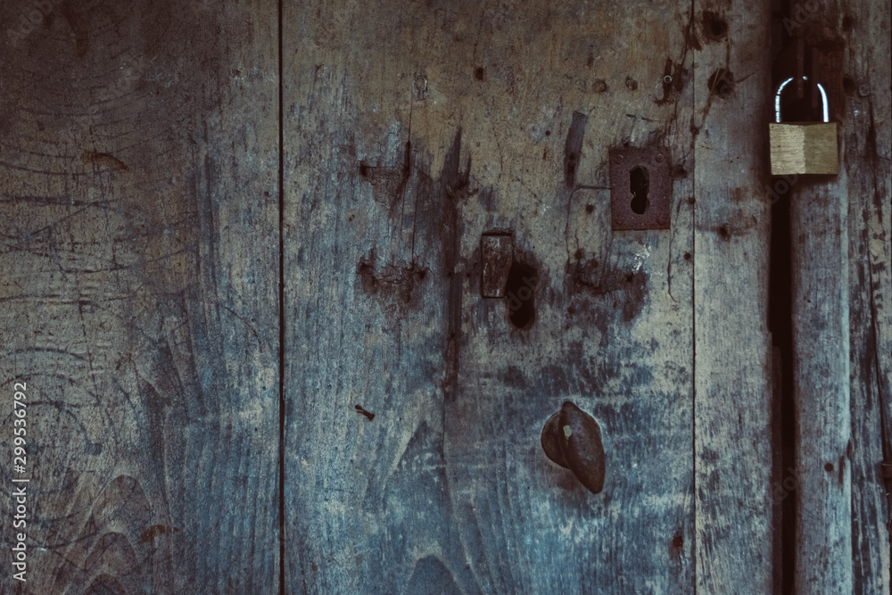 Old wooden door with rusty lock and padlock. Old wooden door with rusty lock and padlock.