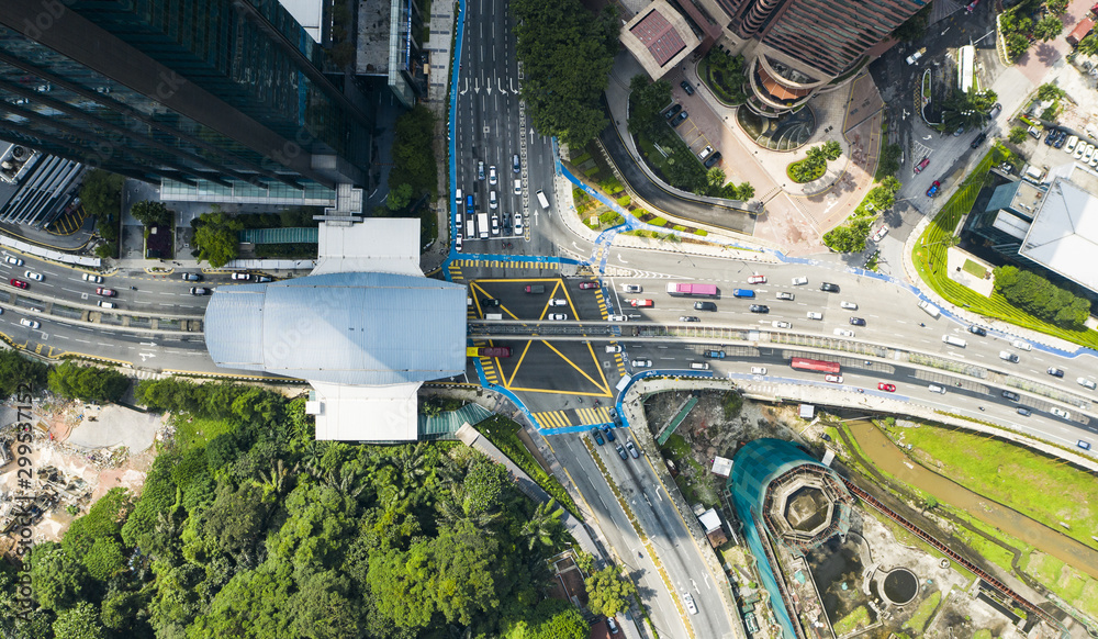 View from above, stunning aerial view of a traffic jam in a road intersection in the middle of Kuala Lumpur city, Malaysia