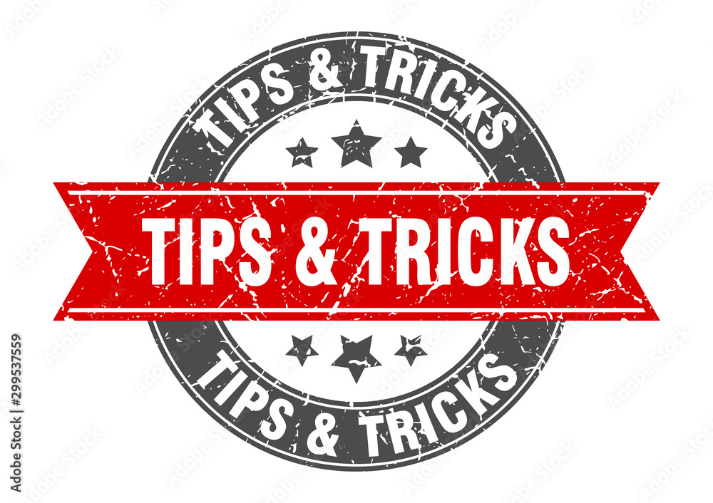 Fototapeta premium tips & tricks round stamp with red ribbon. tips & tricks