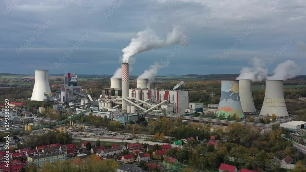 Aerial view of huge coal thermal power plant, steaming chimney and cooling towers - industrial landscape panorama of Europe from above Aerial view of huge coal thermal power plant, steaming chimney and cooling towers - industrial landscape panorama of Europe from above