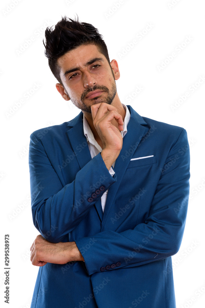 Young handsome bearded Persian businessman in suit Young handsome bearded Persian businessman in suit