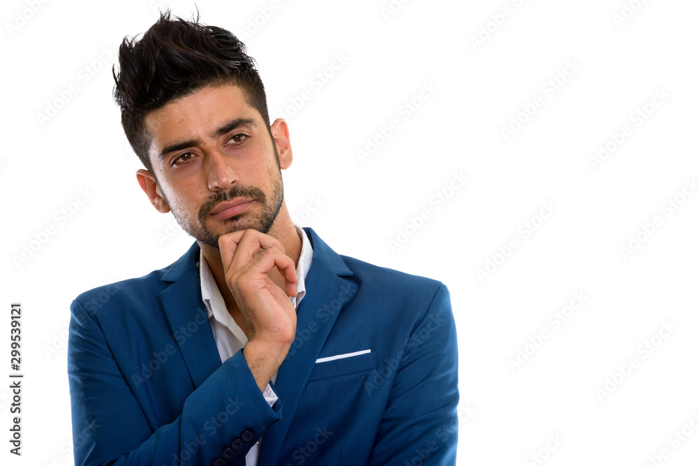 Young handsome bearded Persian businessman in suit