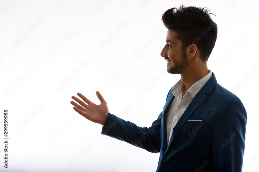 Young handsome bearded Persian businessman in suit Young handsome bearded Persian businessman in suit