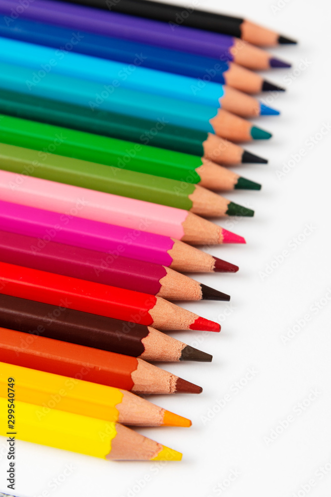 Fototapeta premium Color pencils isolated on a white background with copy space. Office, education concept. Work table, work space