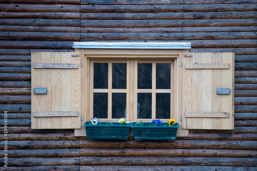 window in an old wooden cottage