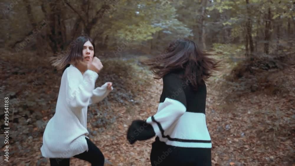 Beauty woman is run away on forest from suspect, maniac. Crime concept, Victim girls are flee behind trees. Girls need help, scary, alone, horror concept. 