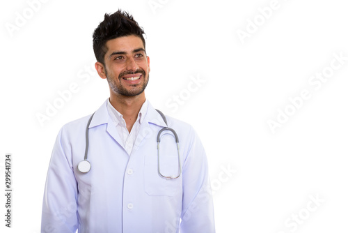 Portrait of young handsome bearded Persian man doctor