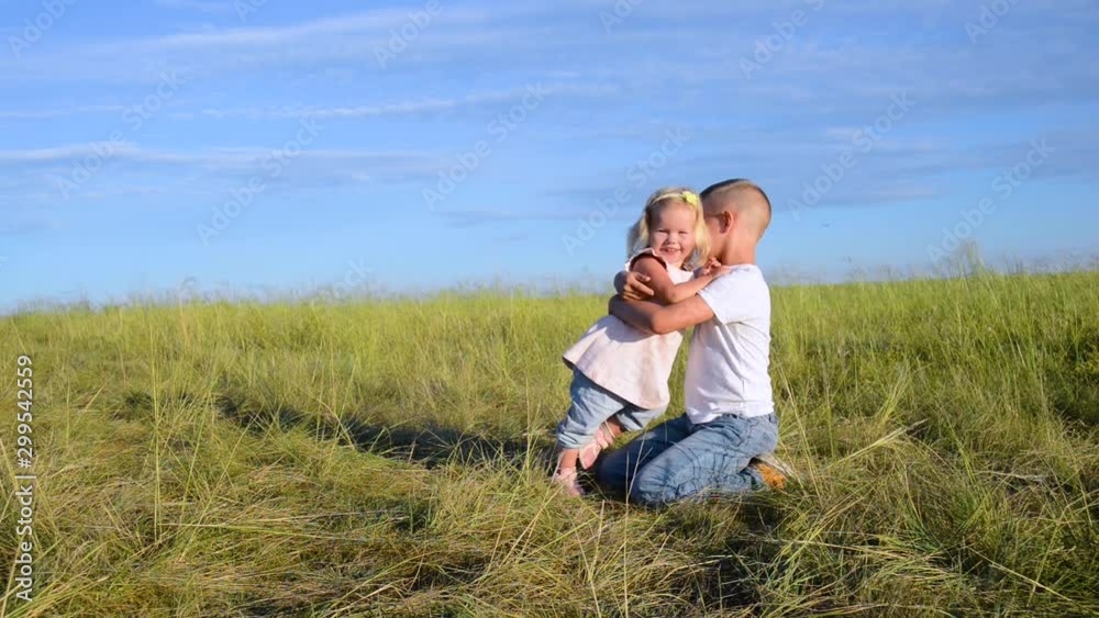 boy and girl hugging in the field boy and girl hugging in the field