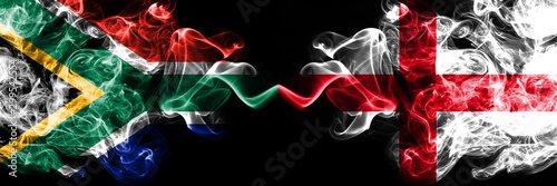 English vs South Africa, African smoky mystic flags placed side by side. Thick colored silky smokes flag of England and South Africa, African.