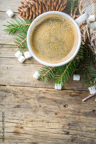 Christmas winter coffee cup with marshmallow, Breakfast christmas morning concept. With xmas tree and decoration on rustic wooden background banner