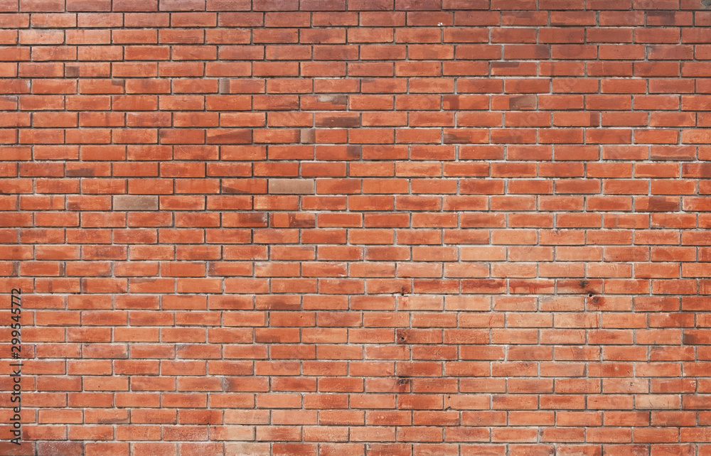 The background of the brick wall with dark orange is beautifully arranged. Ancient wall Grunge background The backdrop may be used in interior design. The background of the brick wall with dark orange is beautifully arranged. Ancient wall Grunge background The backdrop may be used in interior design.