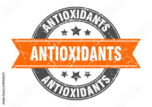 antioxidants round stamp with orange ribbon. antioxidants