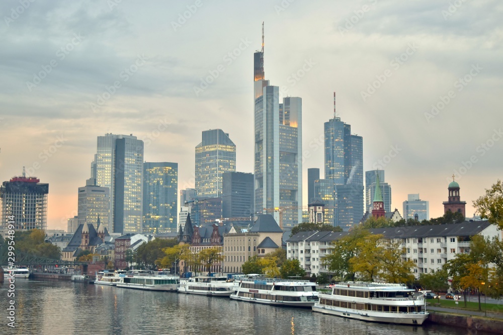 Boats on the Main River, City Park, and Modern Skyline of Downtown Frankfurt in Distance (Sunset / Autumn) - Frankfurt, Germany  