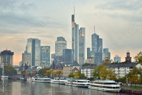 Boats on the Main River, City Park, and Modern Skyline of Downtown Frankfurt in Distance (Sunset / Autumn) - Frankfurt, Germany  