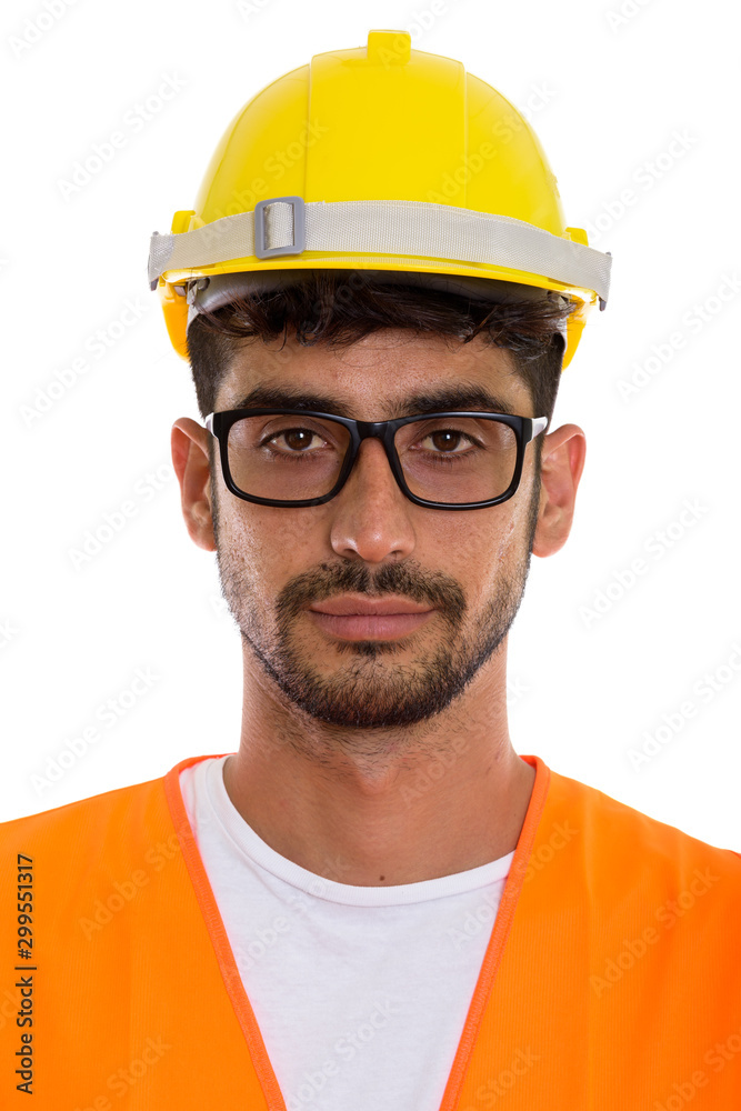 Face of young Persian man construction worker wearing eyeglasses Face of young Persian man construction worker wearing eyeglasses