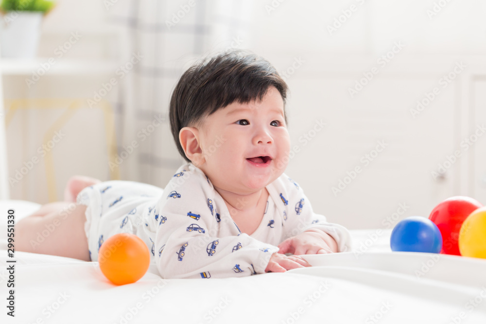 Happy cute adorable Asian baby boy with toys and smiley face. Happy cute adorable Asian baby boy with toys and smiley face.
