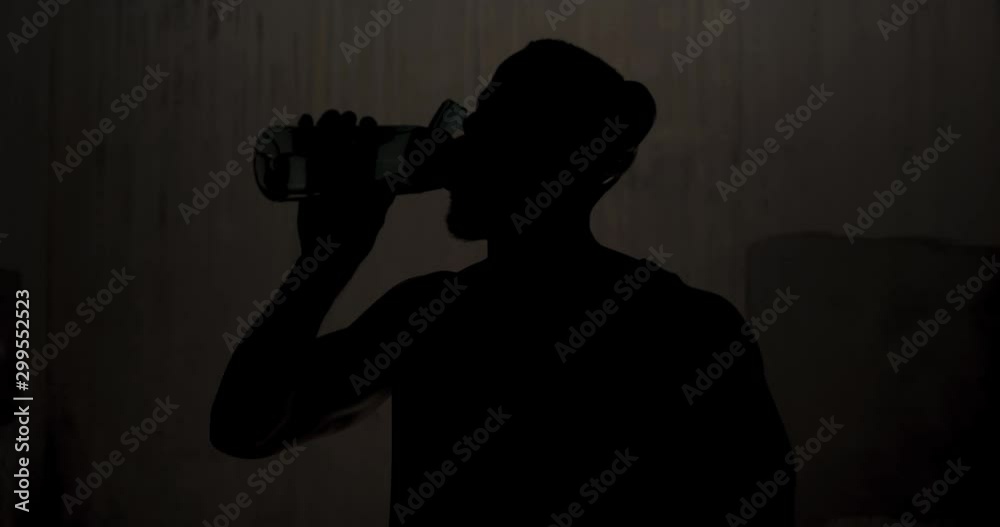 Man exercising in an urban setting taking a break Man exercising in an urban setting taking a break