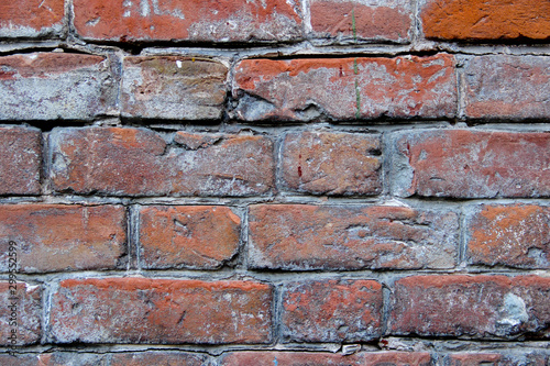 Closeup of old damaged brick wall