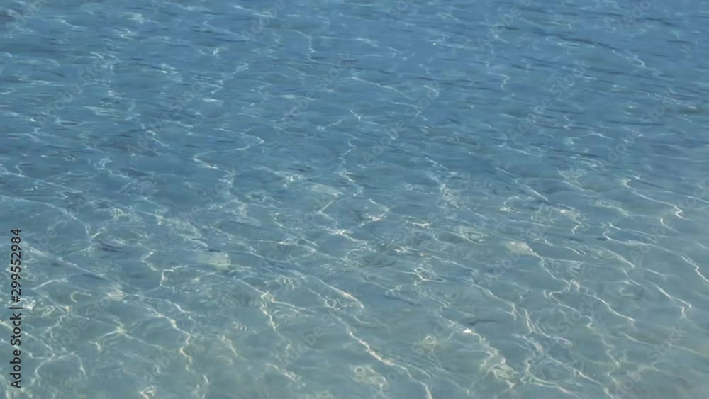 Blue sea wave ripple over the soft sand on the beach Blue sea wave ripple over the soft sand on the beach