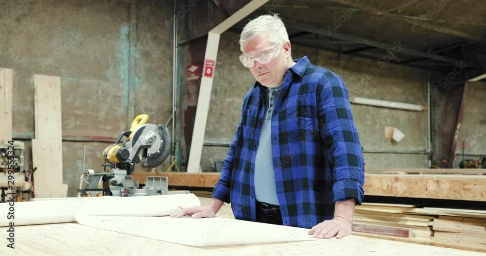Carpenter at work in woodshop Carpenter at work in woodshop