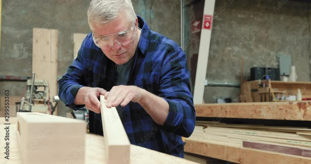 Carpenter at work in woodshop Carpenter at work in woodshop