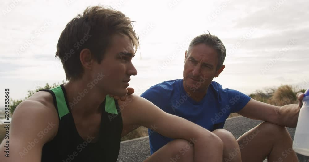 Father and young adult son enjoying outdoor activities together Father and young adult son enjoying outdoor activities together
