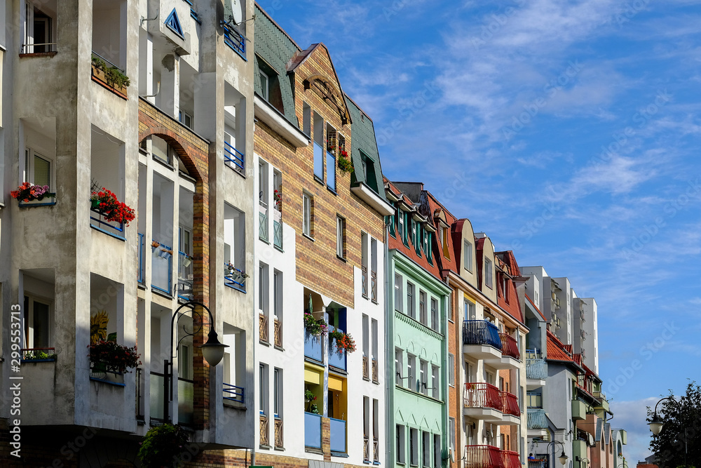 Colorful townhouses in front of blue sky