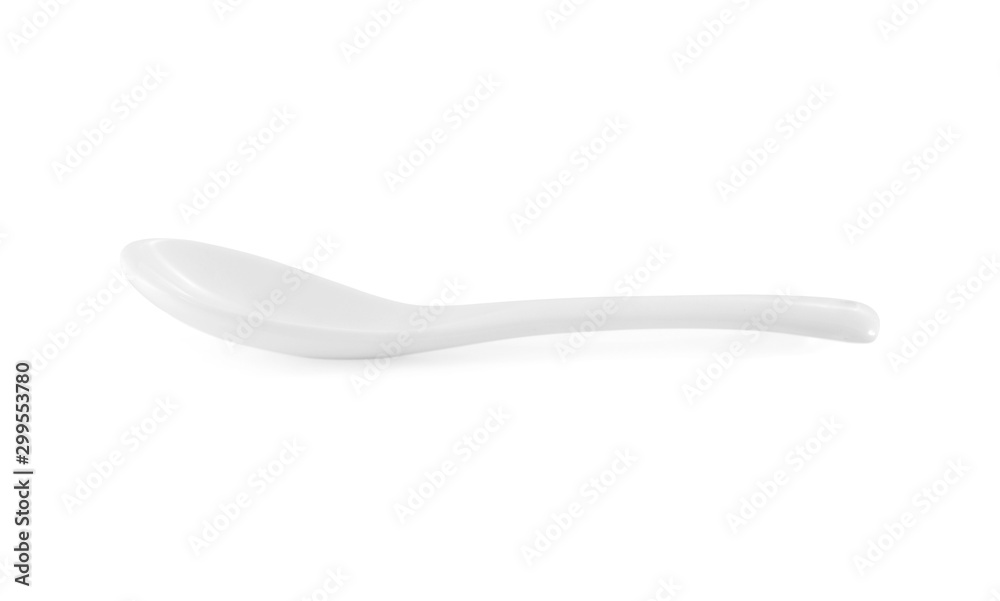 White empty ceramic spoon on white background White empty ceramic spoon on white background