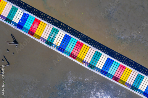 Rainbow bridge in Thailand.View of The colorful wood bridge extends into the sea at samut sakhon province,Thailand,Aerial view. photo