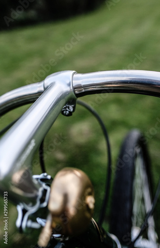 Vintage styled men's adult bicycle showing details of the cycle itself and the racing green painted frame. © Nick Beer
