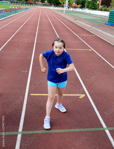 Little girl have fun on the stadium