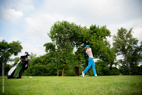 Young man playing golf