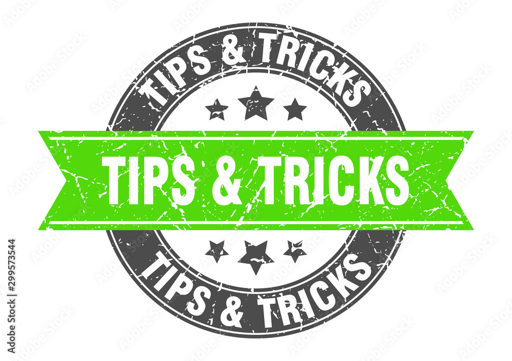 Fototapeta premium tips & tricks round stamp with green ribbon. tips & tricks