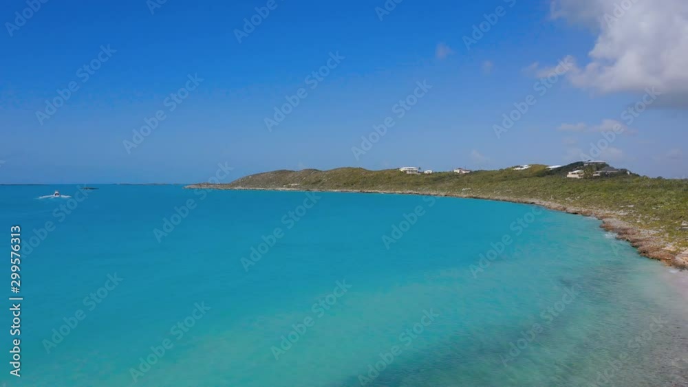 Aerial: Abandoned White Ship Sitting on Deserted White Sandy Beach With Aquamarine Ocean Water - Providenciales, Turks and Caicos Aerial: Abandoned White Ship Sitting on Deserted White Sandy Beach With Aquamarine Ocean Water - Providenciales, Turks and Caicos