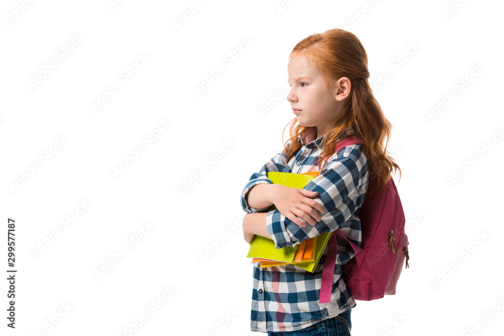 upset redhead kid holding books isolated on white upset redhead kid holding books isolated on white