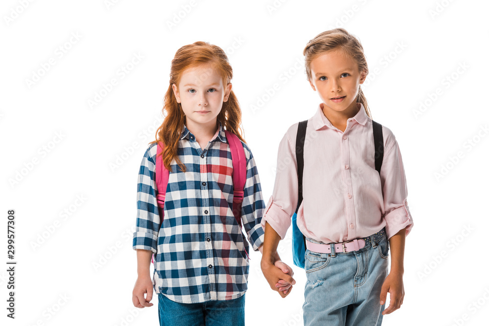 cute schoolkids with backpack holding hands isolated on white cute schoolkids with backpack holding hands isolated on white
