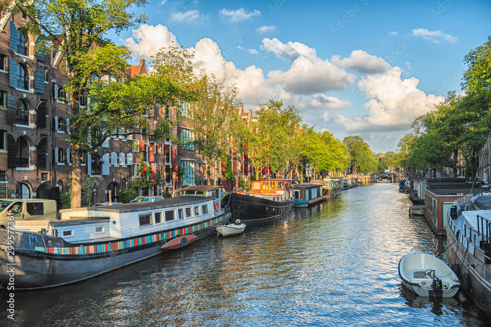 Beautiful views of the streets, ancient buildings, people, embankments of Amsterdam.